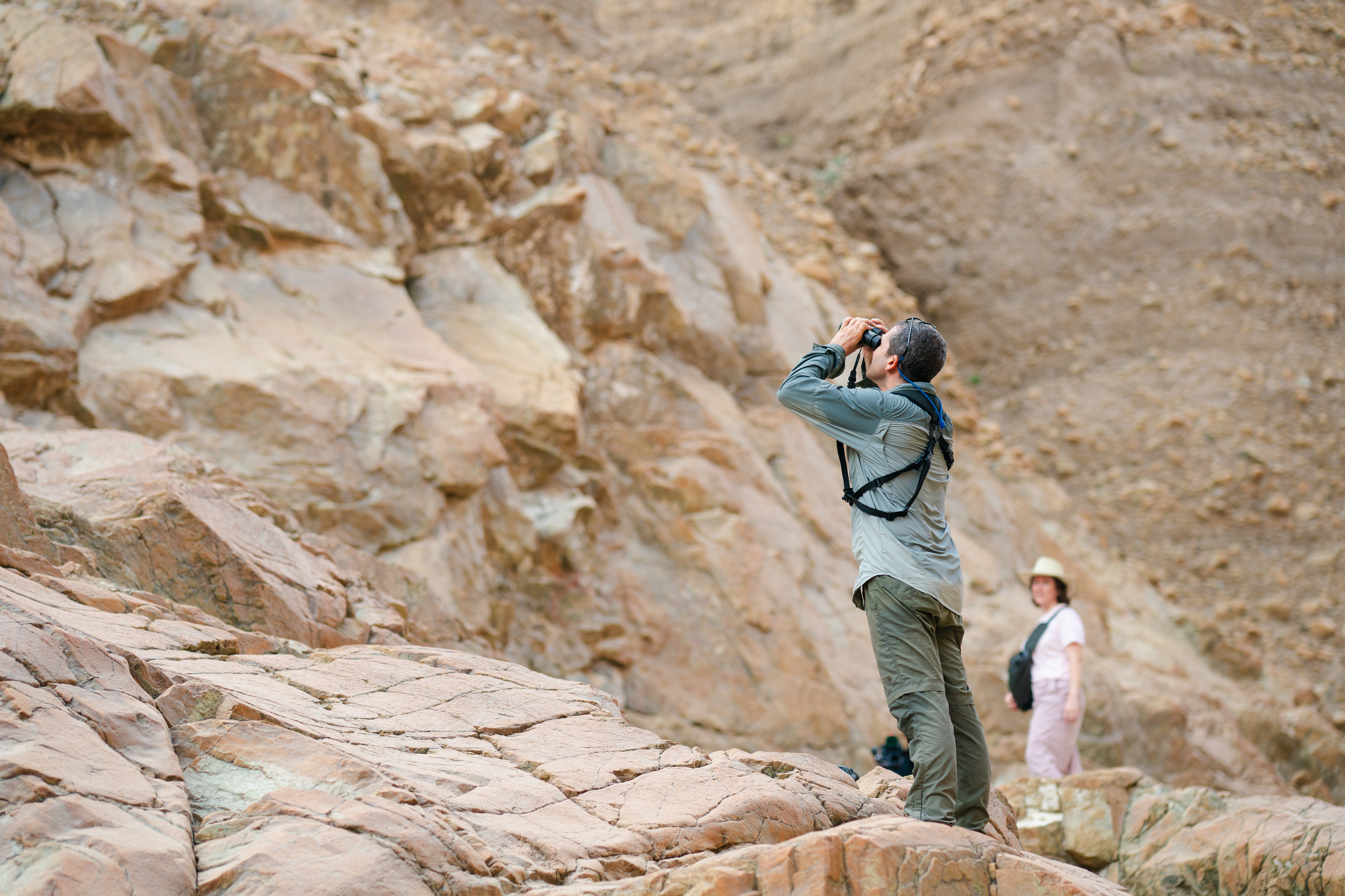 Person looking through binoculars